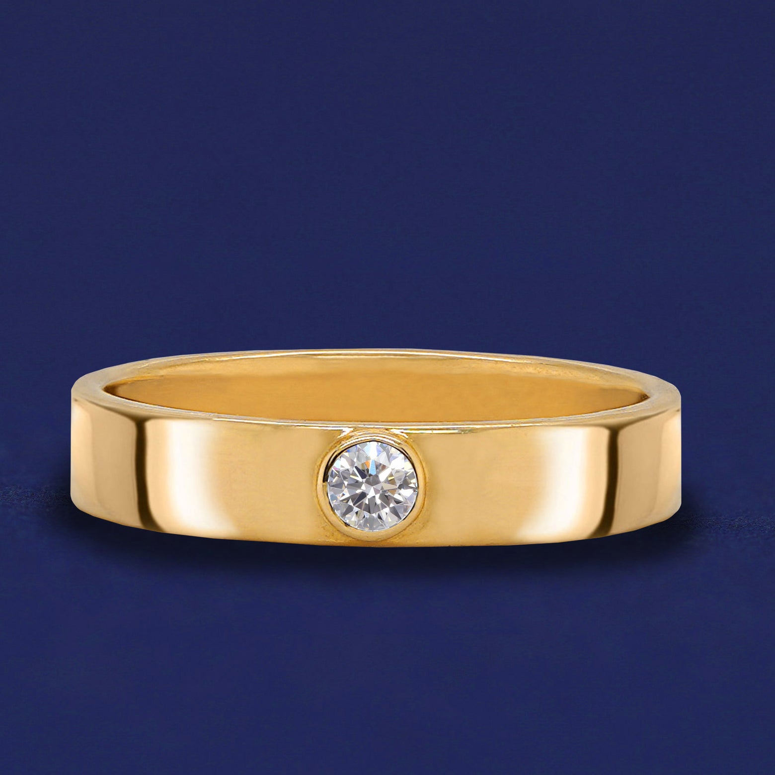 A solid yellow gold Moissanite Gemstone Industrial ring