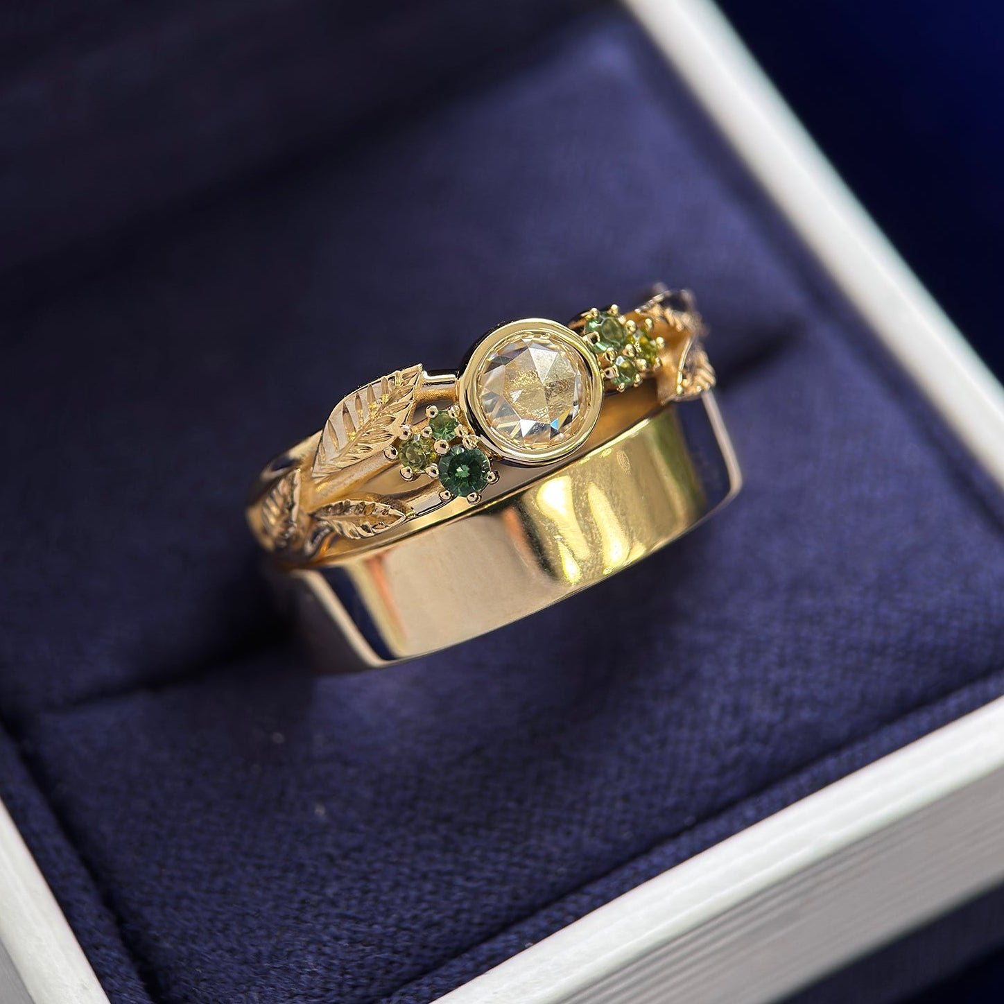 14k Yellow Gold Bezel-set 5mm Rose-cut Moissanite and Cluster of Small Green Sapphires on Custom Leaves Band with Industrial Mirror Band, Sizes 7 and 7.75
