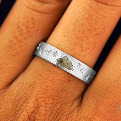Close up view of a model's fingers wearing a 925 silver Cloud Diamond Band