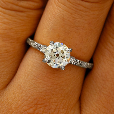 A solid 950 platinum Old Mine Cut Lab Diamond Filigree Ring on a model's finger