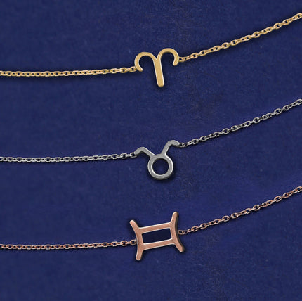 Three Horoscope bracelets with different zodiac symbols show in yellow, white, and rose gold