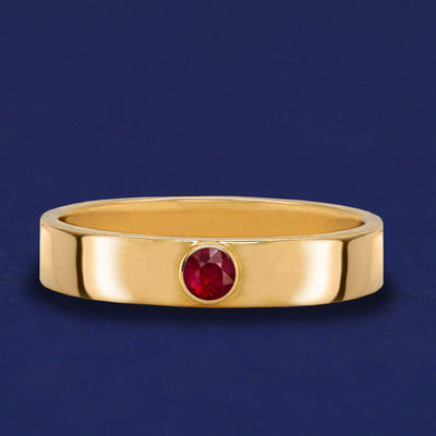 A solid yellow gold Ruby Gemstone Industrial ring