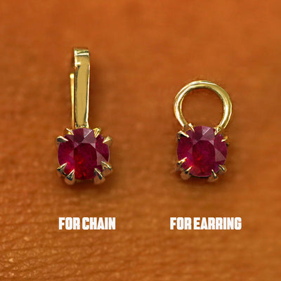 Close up view of a yellow gold ruby Charm  for earring and for necklace