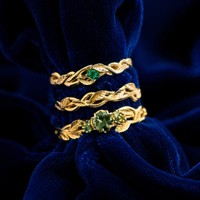 A Gemstone Leaves and Vines Ring, Braided Leaves and Vines Ring, and Green Sapphires Leaves and Vines Ring stacked