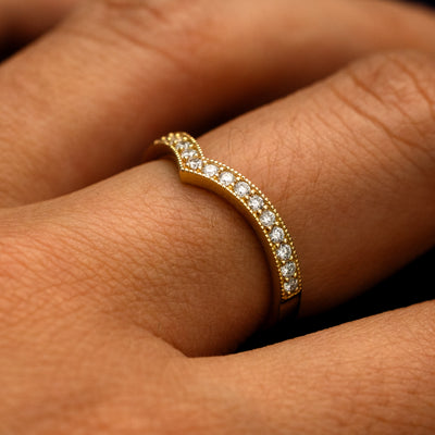 Side view of a Milgrain Pave Diamond Chevron Band on a model's finger