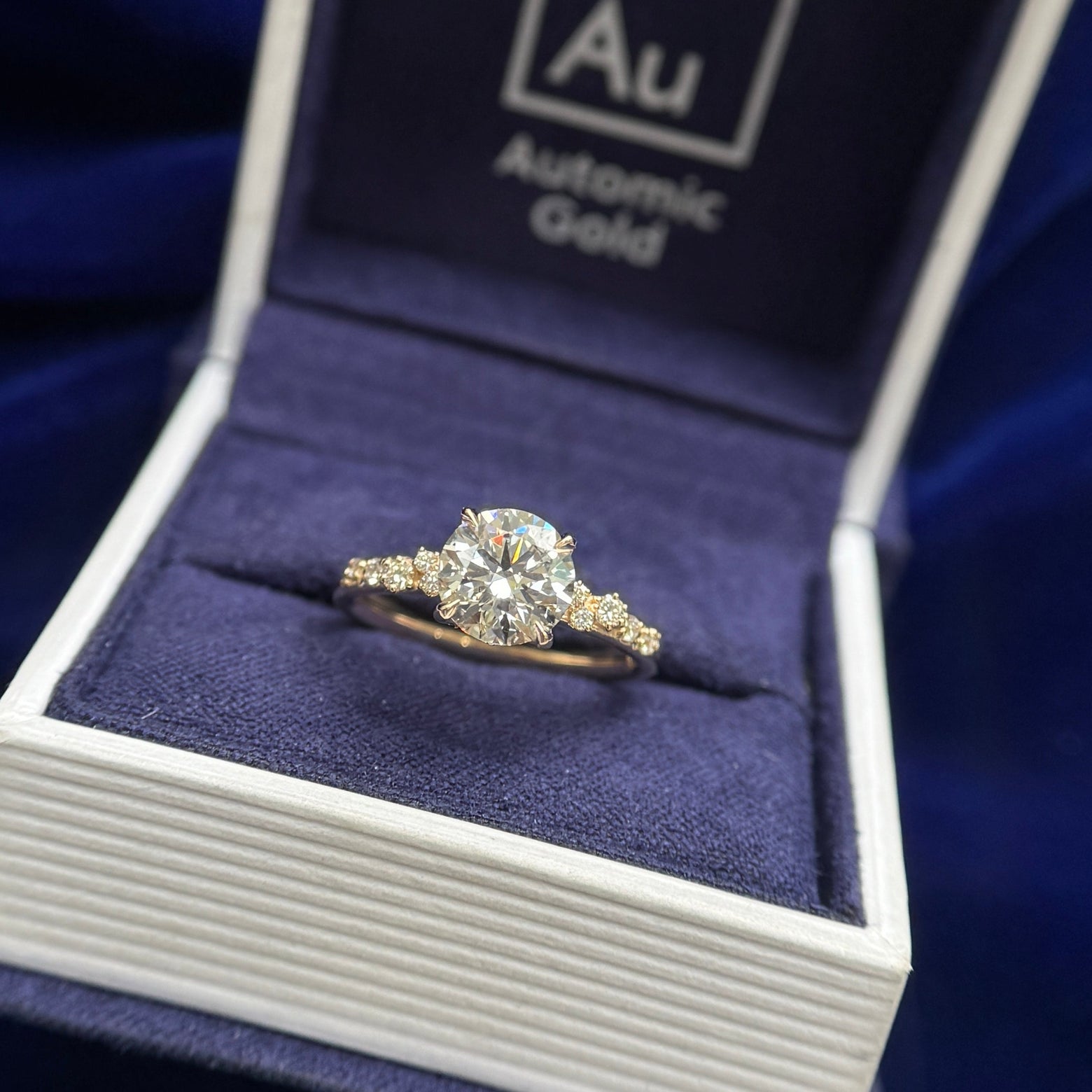 front view of 14k Yellow Gold Claw-Prongs-Petal-Set 1.5ct Round Lab Diamond with 10pcs Lab Diamond clusters on 2mm Mix Mirror Band Custom Ring, Size 6.25