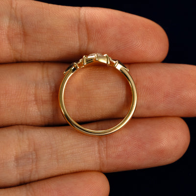 A Hexagon Salt and Pepper Diamond Black and White Ring in a model's hand showing the thickness of the band