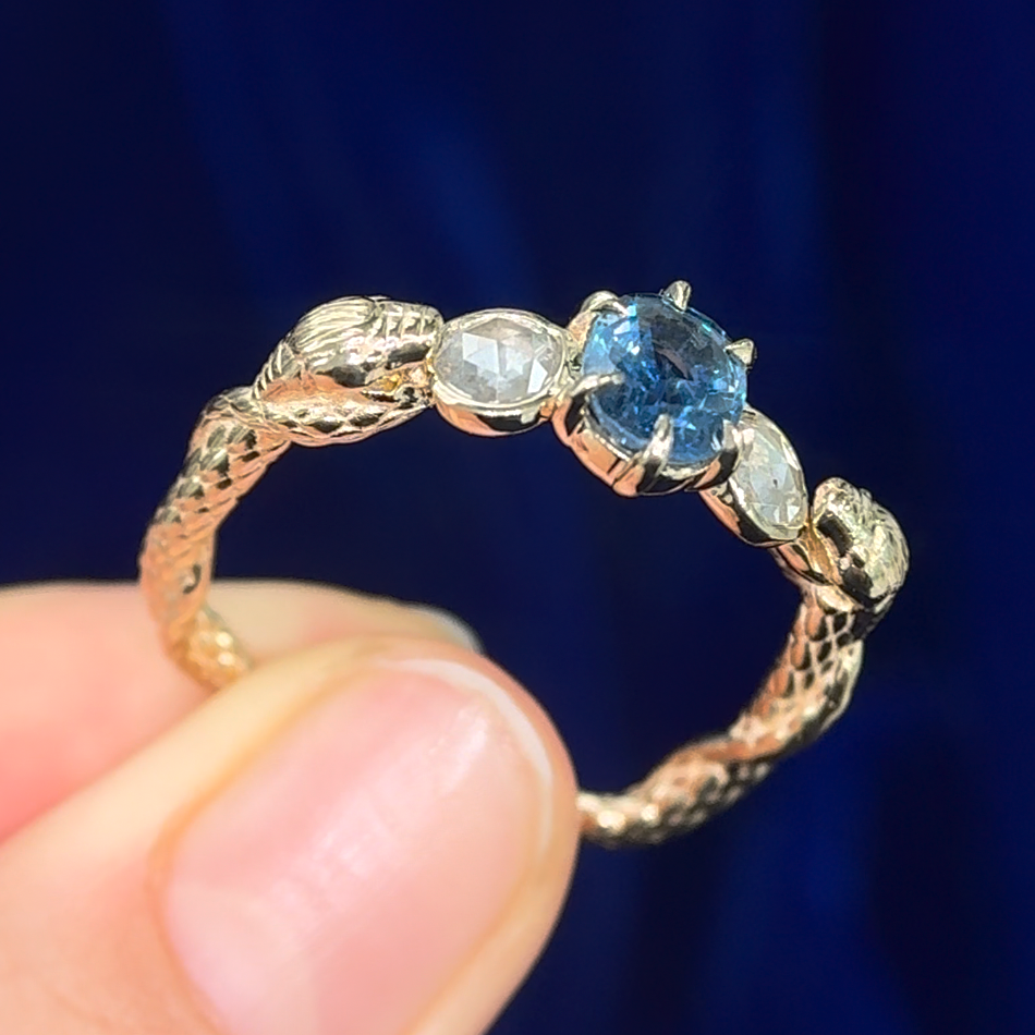 14k Yellow Gold with 1.32ct Light Blue Oval Sapphire and 0.62ct Round Salt-and-pepper Diamonds Guardian Snakes Custom Ring, size 11