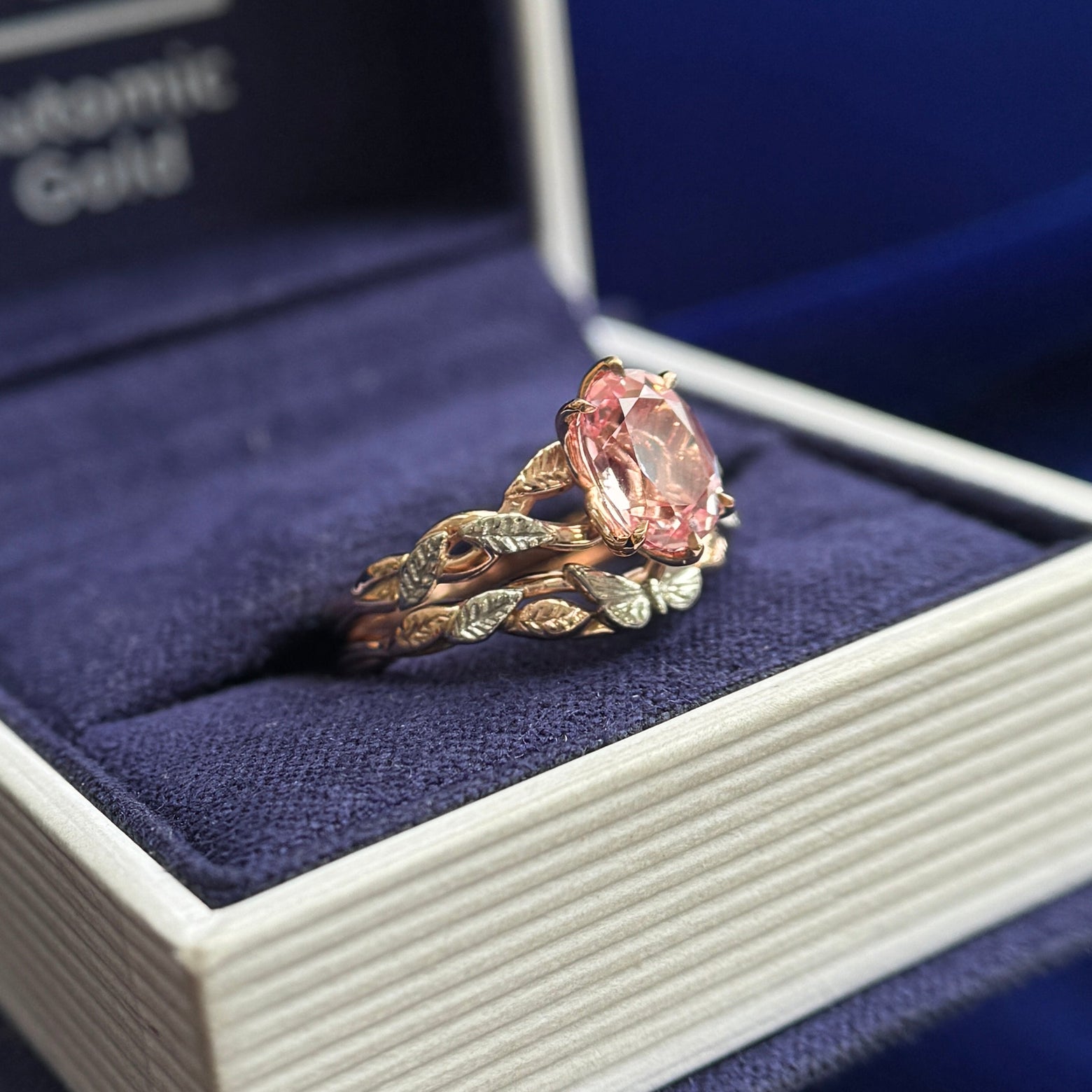 14k Rose Gold and 8x6mm Oval Pink Lab Sapphire on Carved Vine Band with 950 Platinum Textured Leaves Custom Ring and 14k Rose Gold Carved Vine Band with 950 Platinum Butterfly and Textured Leaves Custom Nesting Band, both in size 6