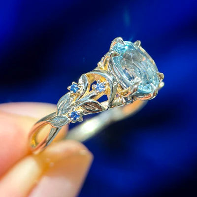 14k Yellow Gold Oval Light Blue Sapphire with Clusters on Leaves and Moons Band Custom Ring