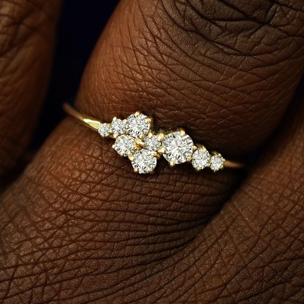 Close up view of a model's fingers wearing a 14k champagne gold Diamond Cluster Ring