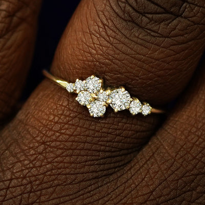 Close up view of a model's fingers wearing a 14k champagne gold Diamond Cluster Ring