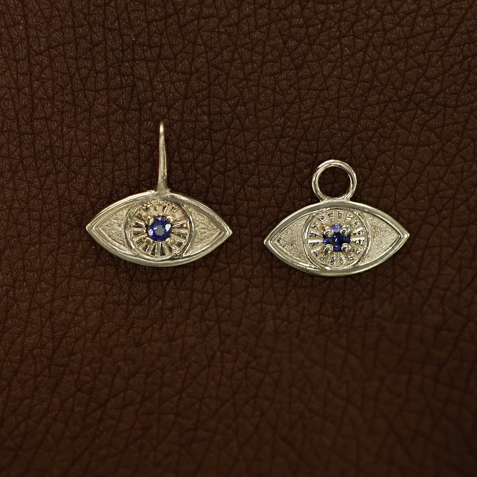 Two 14 karat Champagne gold blue sapphire Evil Eye Charms shown in the For Chain and For Earring options