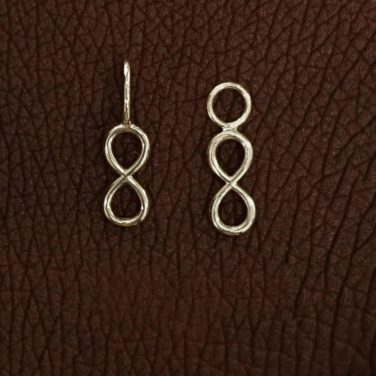 Two 14 karat Champagne solid gold Infinity Charms shown in the For Chain and For Earring options
