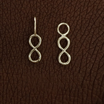 Two 14 karat Champagne solid gold Infinity Charms shown in the For Chain and For Earring options
