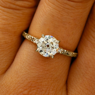 A solid 14k champagne gold Old Mine Cut Lab Diamond Filigree Ring on a model's finger