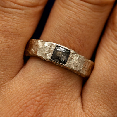 Close up view of a models fingers wearing a 14k champagne gold Square Diamond Organic Band
