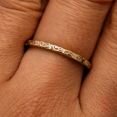 Close up view of a model's fingers wearing a 14k champagne gold Thin Filigree Band