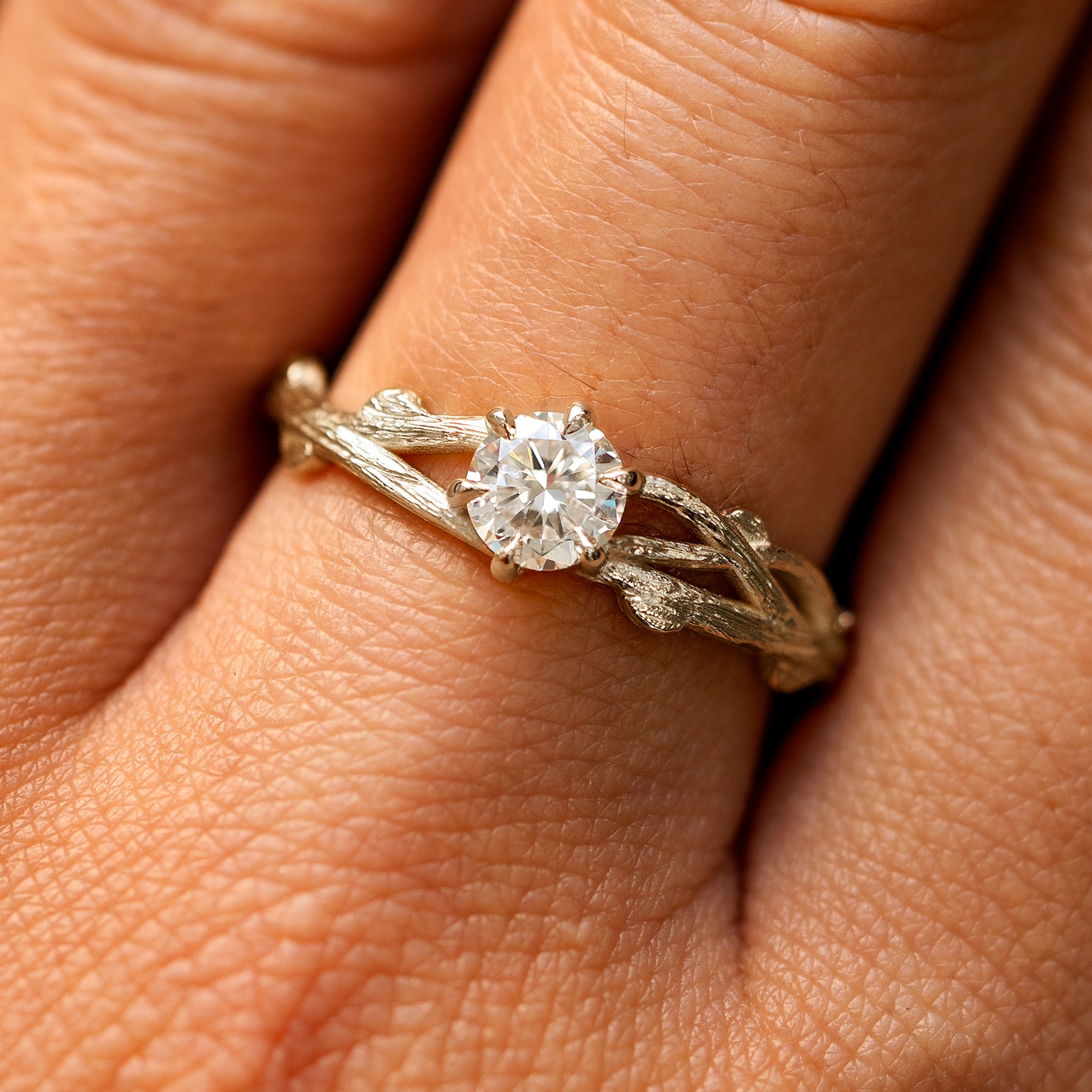 Close up view of a model's fingers wearing a 14k champagne gold lab diamond Branches Ring