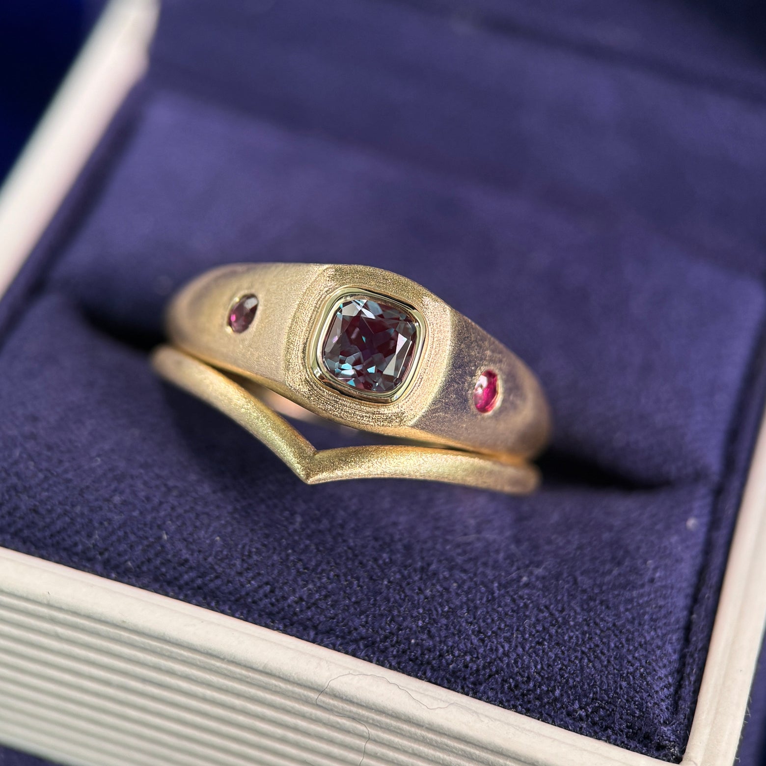 14k Yellow Gold and Bezel-set 5mm Cushion Alexandrite with 2pc Customers Rubies on the sides Brushed Custom Signet Ring and 14k Yellow Gold 1.7mm Chevron Brushed Custom Ring, both insize 10.25