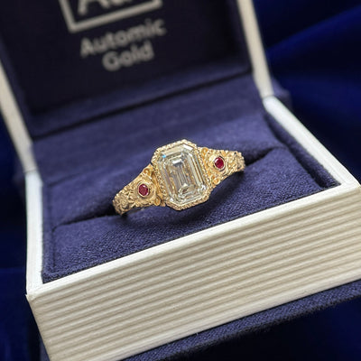 14k Yellow Gold Milgrain-Bezel-set 2.5ct Emerald-cut Lab Diamond with 2pc 2mm Lab Rubies with Floral Engravings Tapered Band Custom Ring, Size 8
