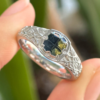 front view of 14k White Gold and 1ct Kosnar Yellow-blue Fantasy Cut Bicolor Clover Shaped Sapphire with 4pc Diamonds on Thick Tapered Thorns Engraved Band Custom Signet Ring, size 8.5