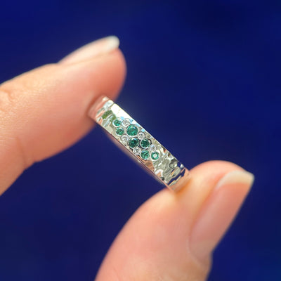 band with flash set emeralds and diamonds