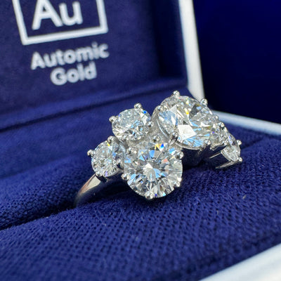 Lab diamond cluster ring in a blue ring box