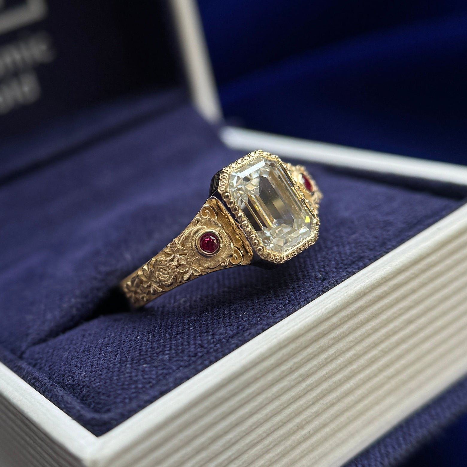 14k Yellow Gold Milgrain-Bezel-set 2.5ct Emerald-cut Lab Diamond with 2pc 2mm Lab Rubies with Floral Engravings Tapered Band Custom Ring, Size 8