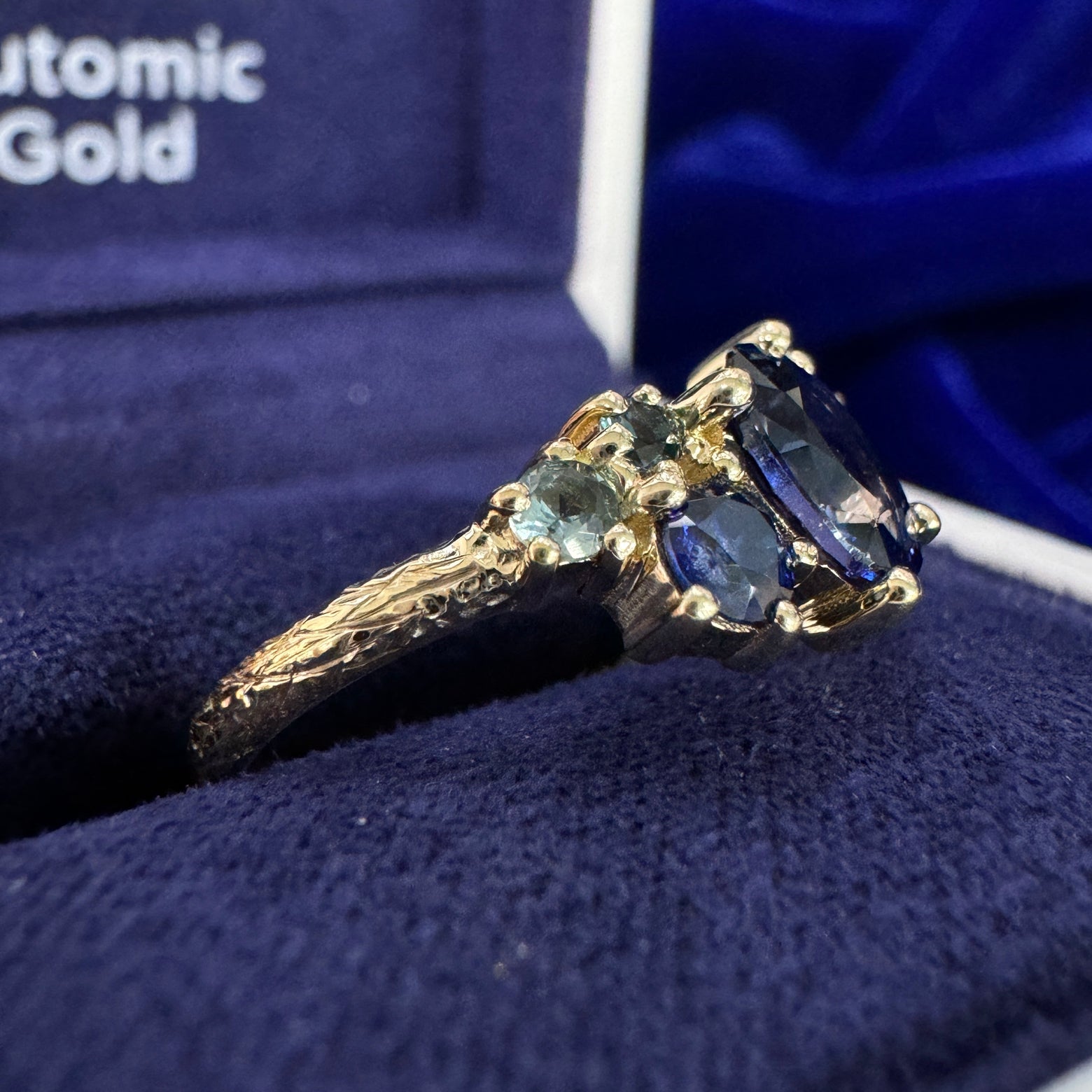 14k Yellow Gold Claw-prongs-set 0.90ct 7x5.1mm Oval Blue Sapphire w/ Round Blue/Purple/Teal Sapphires Cluster on 2mm Curvy Band Custom Ring 