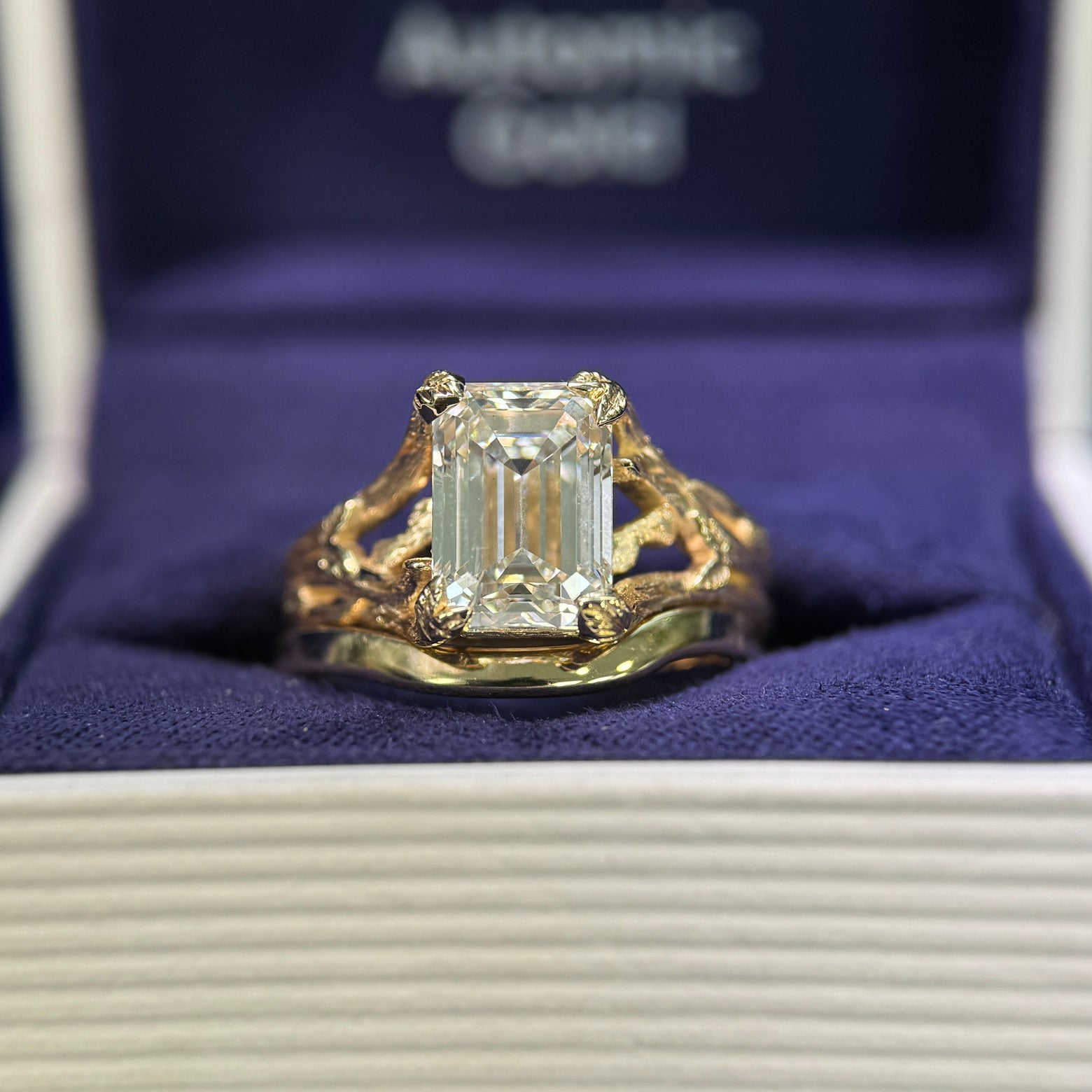 14k Yellow Gold and 3ct Emerald-cut Lab Diamond Leaves and Branches set Custom Ring and 14k Yellow Gold Mixed Mirror Band 2.5mm Custom Order Curving Around Engagement Ring, both in size 6.5