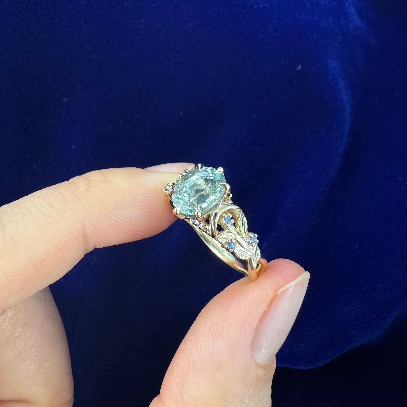 14k Yellow Gold Oval Light Blue Sapphire with Clusters on Leaves and Moons Band Custom Ring