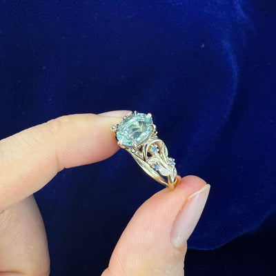 14k Yellow Gold Oval Light Blue Sapphire with Clusters on Leaves and Moons Band Custom Ring