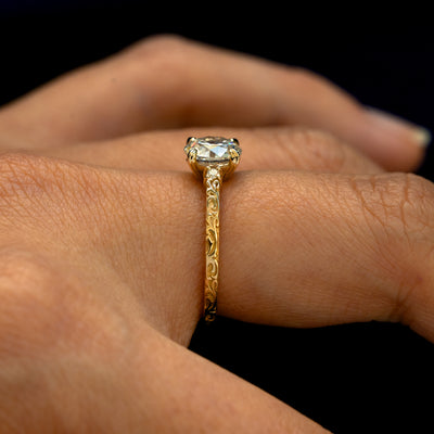 Side view of an Old Mine Cut Lab Diamond Filigree Ring on a model's finger to show the filigree details on the band