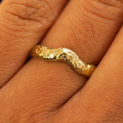 Close up view of a model's fingers wearing a 14k Organic Liquid Band