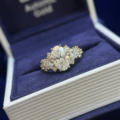 14k Yellow Gold Prongs-set 1.5ct Oval Lab Diamond with 2pcs 4mm Moissanites and 5pcs Round Lab Diamonds on Thin Curvy Mirror Band, Size 5.25
