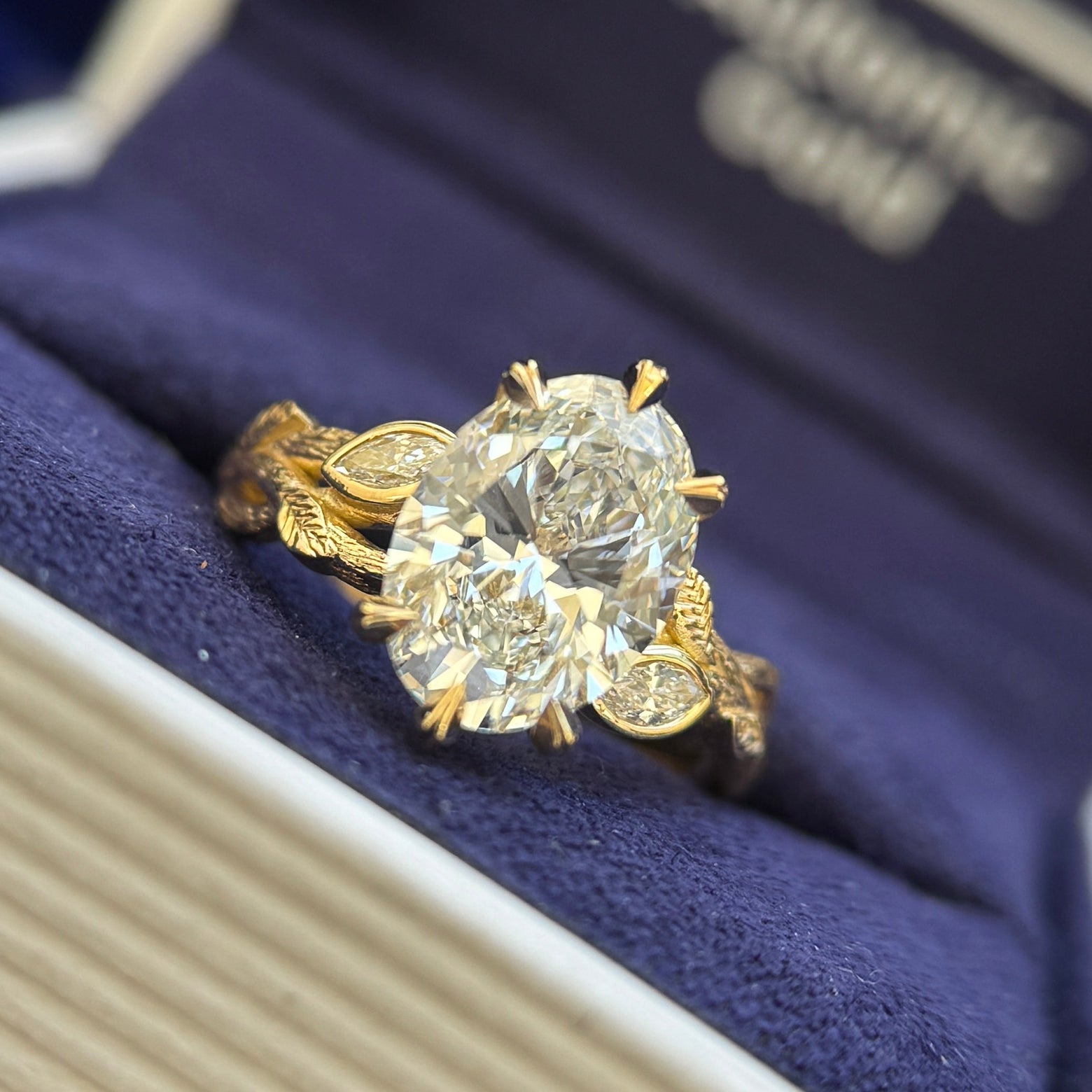 18k Yellow Gold and 2ct Oval Lab Diamond with Marquise Lab Diamonds Accents on Engraved Leaf Branch Band Custom Ring, size 4