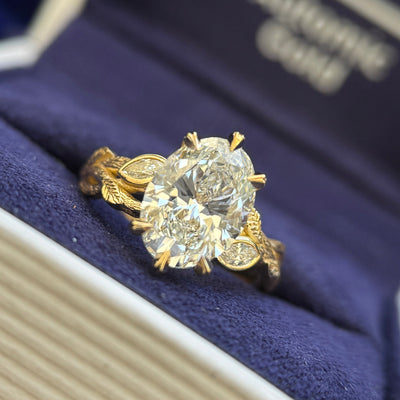 18k Yellow Gold and 2ct Oval Lab Diamond with Marquise Lab Diamonds Accents on Engraved Leaf Branch Band Custom Ring, size 4