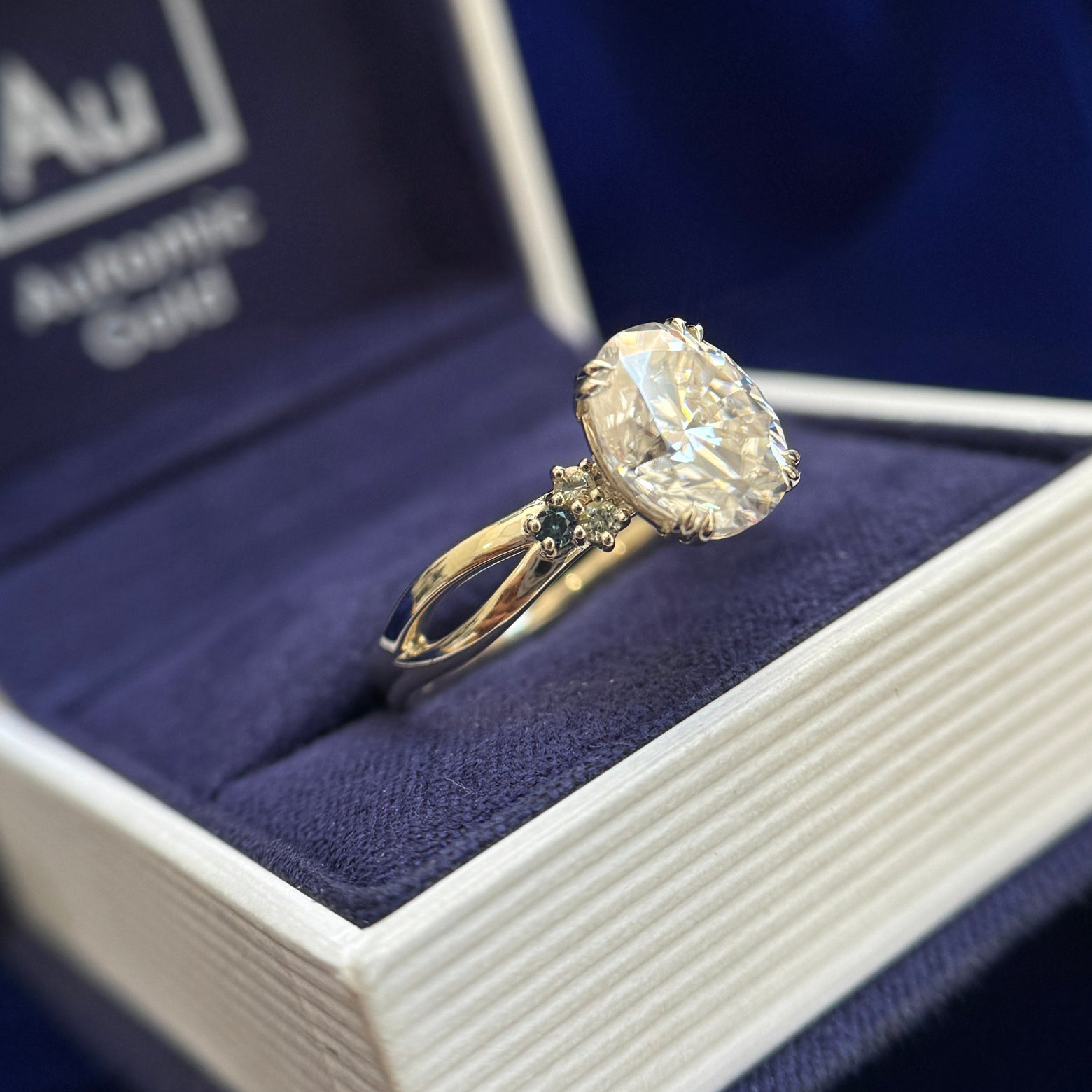 14k Champagne Gold and 2ct 9x7mm Oval Moissanite with 6pc Round Small Sapphires Cluster on 2mm Mix Mirror Band Custom Ring, size 10