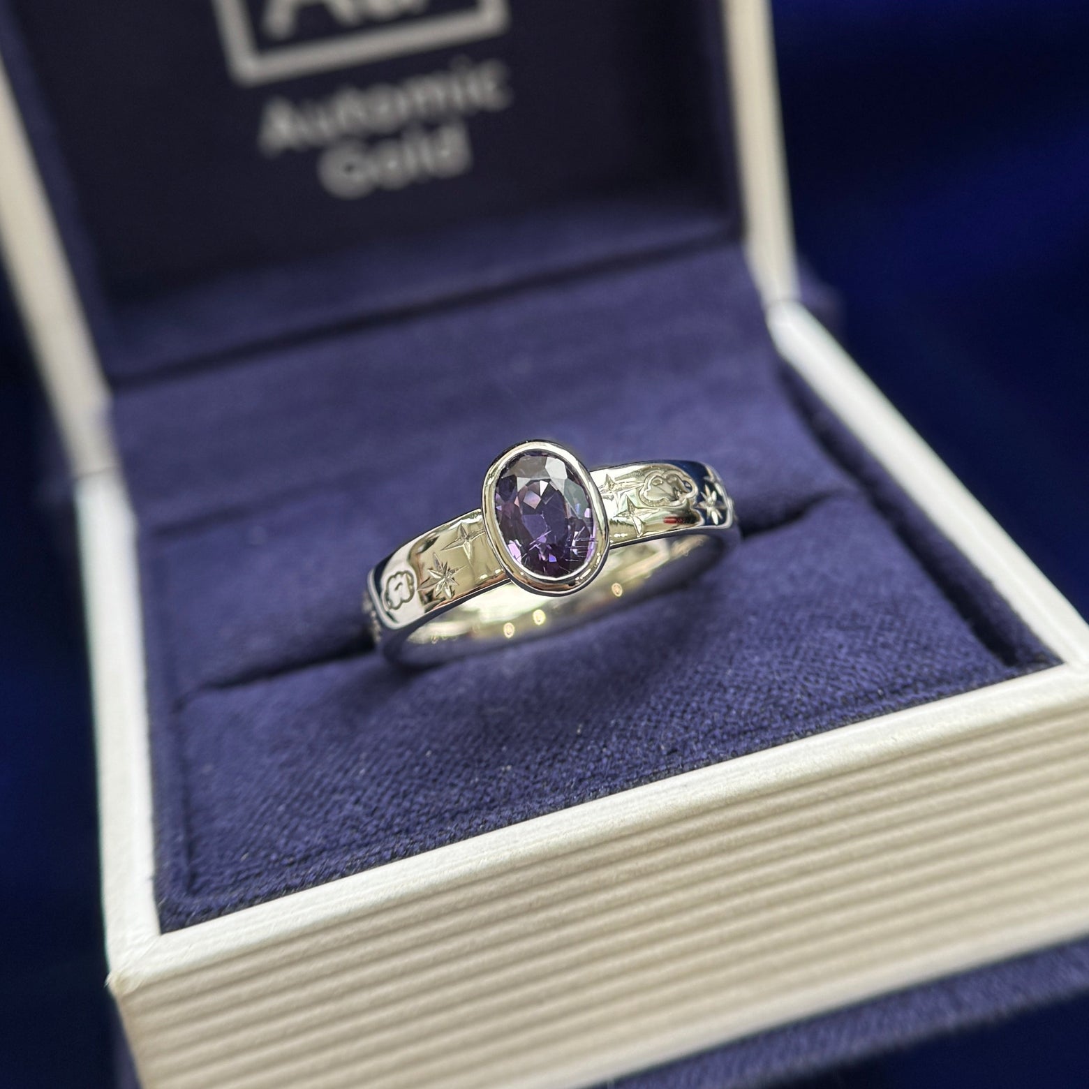 950 Platinum and Low Bezel Set 1.12ct 5x7mm Purple Oval Sapphire on 4mm Comfort-fit Band Engraved with Clouds Sun Moon Stars Custom Ring, size 6.5 