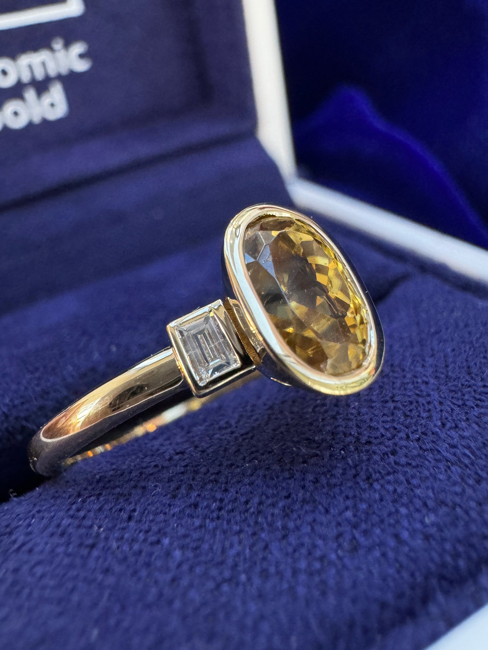 14k Yellow Gold with Bezel-set Customer’s Oval Yellow Sapphire with Half-bezel-set Customer’s Baguette Diamonds on Thin Band Custom Ring