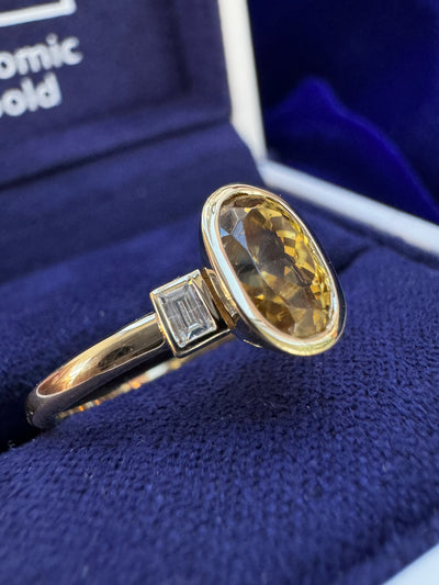 14k Yellow Gold with Bezel-set Customer’s Oval Yellow Sapphire with Half-bezel-set Customer’s Baguette Diamonds on Thin Band Custom Ring
