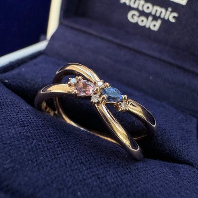 14k Rose Gold Bezel-set Custom-cut Pear Ceylon Blue Lab Sapphire & Pear Purple Lab Sapphire w/ 4pc Round Lab Diamonds on Thin Twisting Band Custom Ring