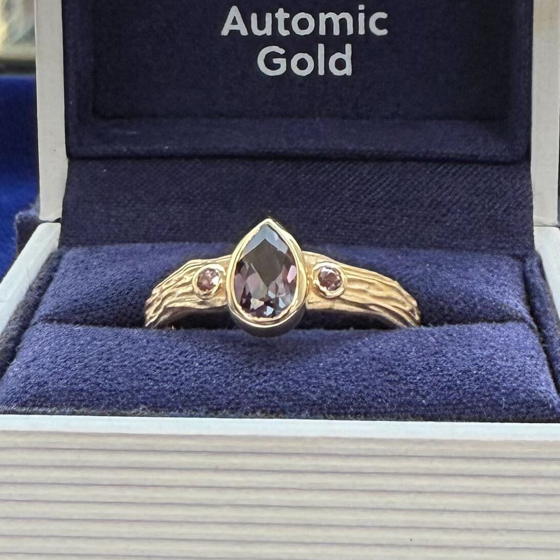 14k Yellow Gold with 1ct 8x5mm Pear Purple-gray Lab Sapphire with 2pc Purple Sapphires on sides on Custom Raw Band, Size 8.5