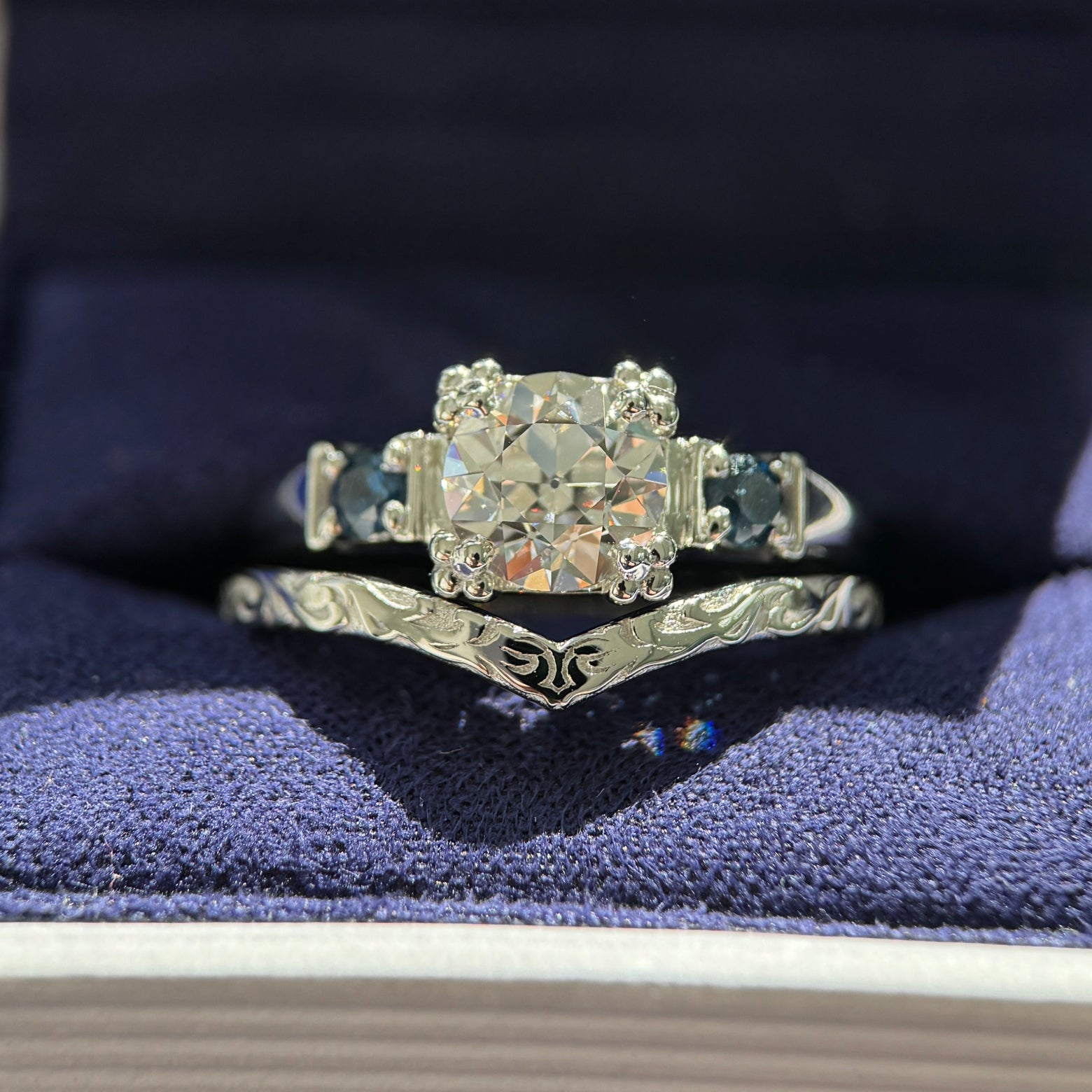 950 Platinum & 4-Leaf-prong-set 1.5ct Antique-cut Round Lab Diamond with 2pc 3mm Customer’s Sapphires Custom Ring with 960 Platinum Custom Nesting Filigree Band