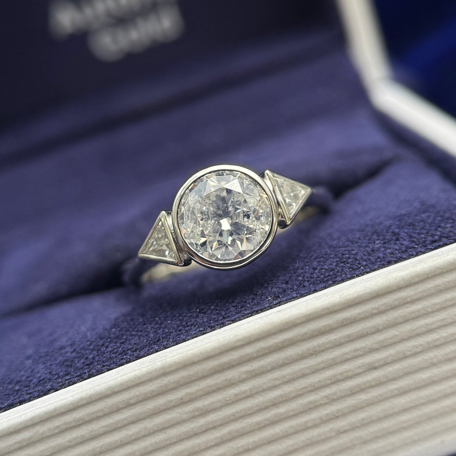 950 Platinum and Clients Round Diamond reset into 6 claws low set with two Bezel-set Triangles Diamonds on Thin to Thick Band Custom Ring, size 5