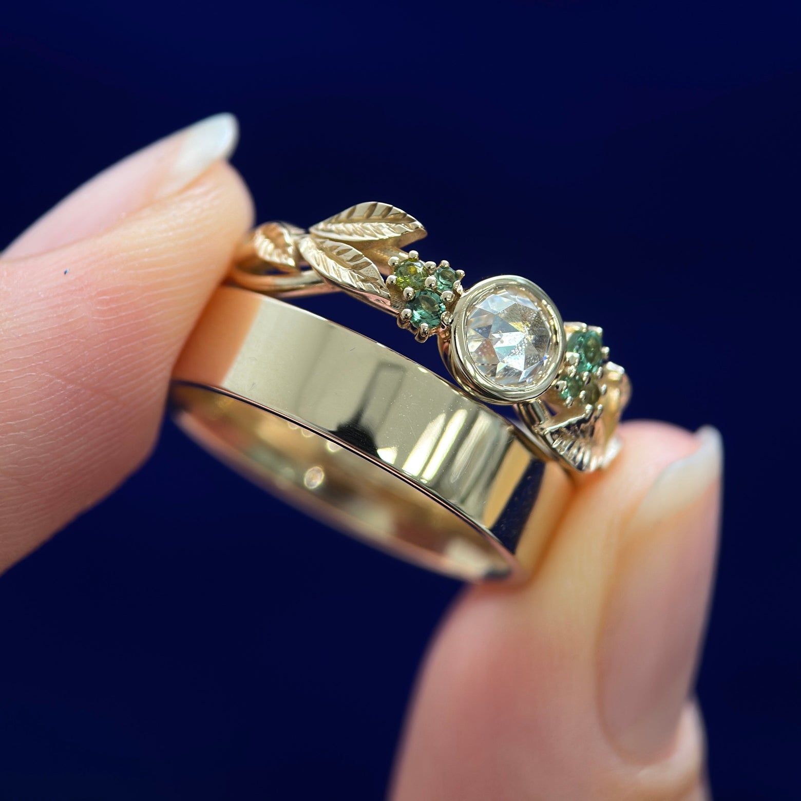 14k Yellow Gold Bezel-set 5mm Rose-cut Moissanite and Cluster of Small Green Sapphires on Custom Leaves Band with Industrial Mirror Band, Sizes 7 & 7.75