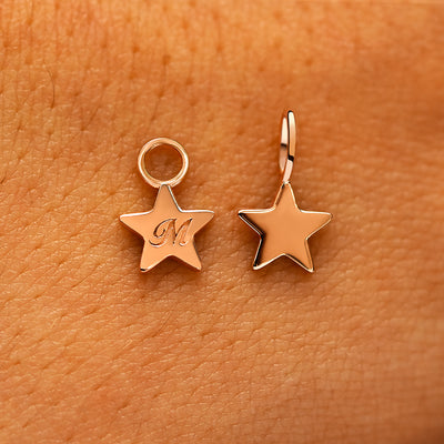 Two solid 14k rose gold Star Charms showing the for chain and the for earring options