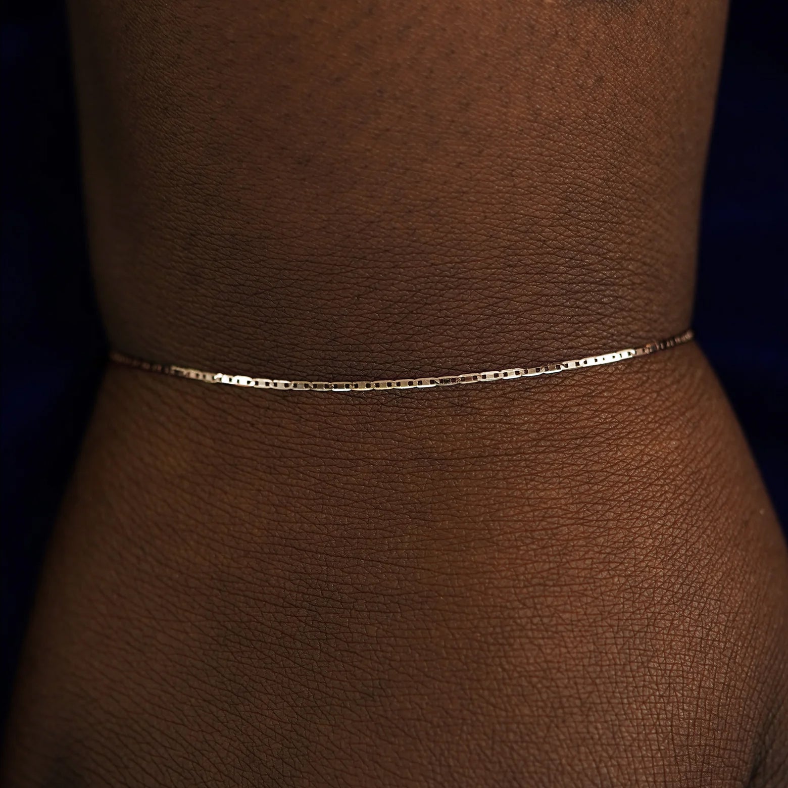 Close up view of a model's wrist wearing a rose gold Valentine Bracelet