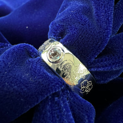 14k White Gold Bezel Set 4mm Round Alexandrite on 8-6mm Curvy Tapered Mixed Flowers Engraved Custom Band